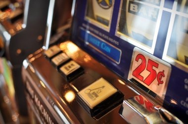 Jurassic Kingdom reel layout on mobile display showing dinosaur symbols and fossil icons
